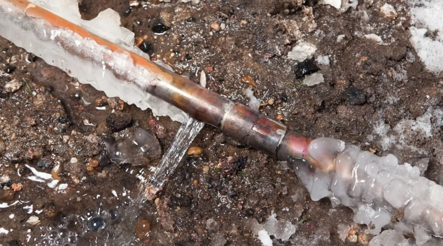 Frozen Pipe that Has Burst And Leaked Water All Over Ground